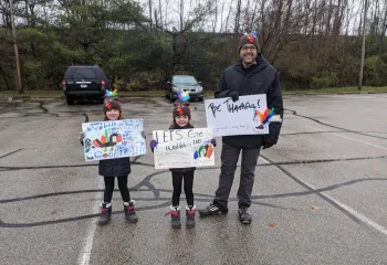 YMCA members cheering on racers