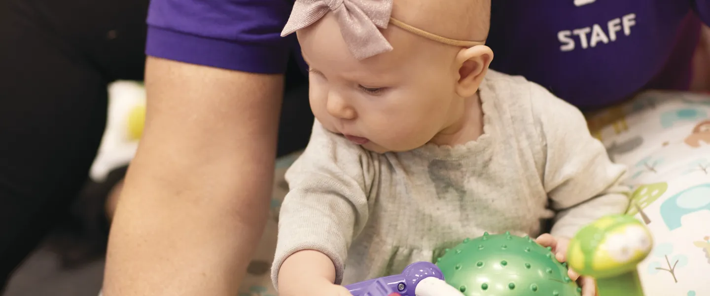 YMCA employee with infant