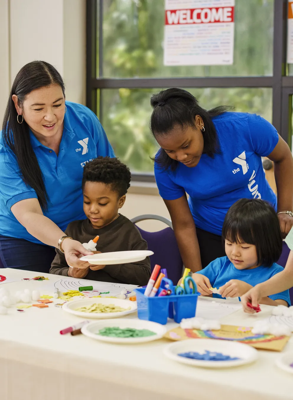 Teachers and kids at after school care at YMCA